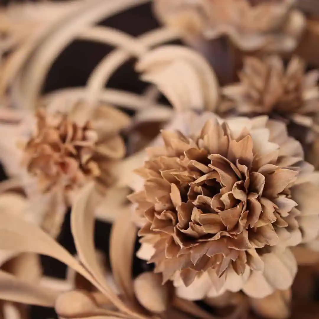 Detailed limewood flower blossoms in deep relief, custom wood carving by Alexander Grabovetskiy.