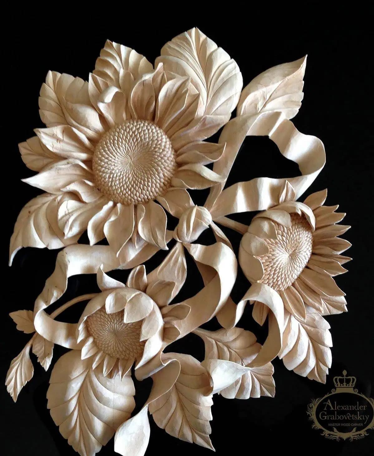 Deep-relief sunflower panel hand-carved in limewood by Alexander Grabovetskiy, an ornamental custom wood carving.