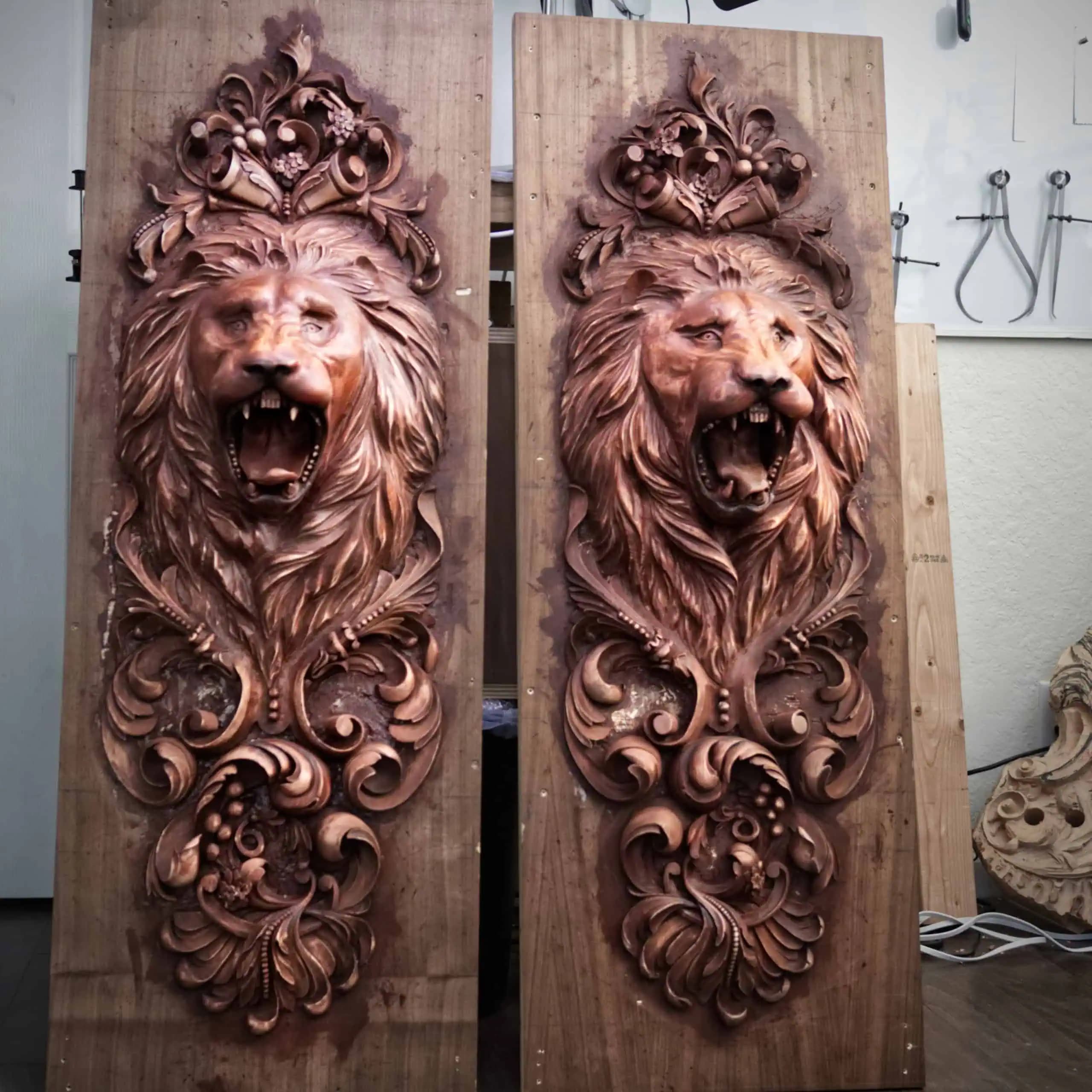 Pair of limewood lion head panels with acanthus scrolls, custom wood carving by Alexander Grabovetskiy.