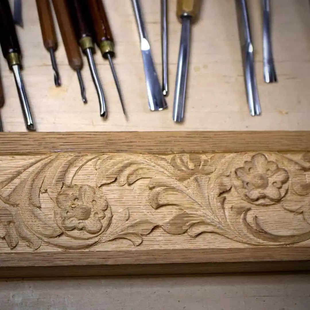 Oak molding with carved acanthus scrolls and rosettes by Alexander Grabovetskiy, a custom wood carving in progress.