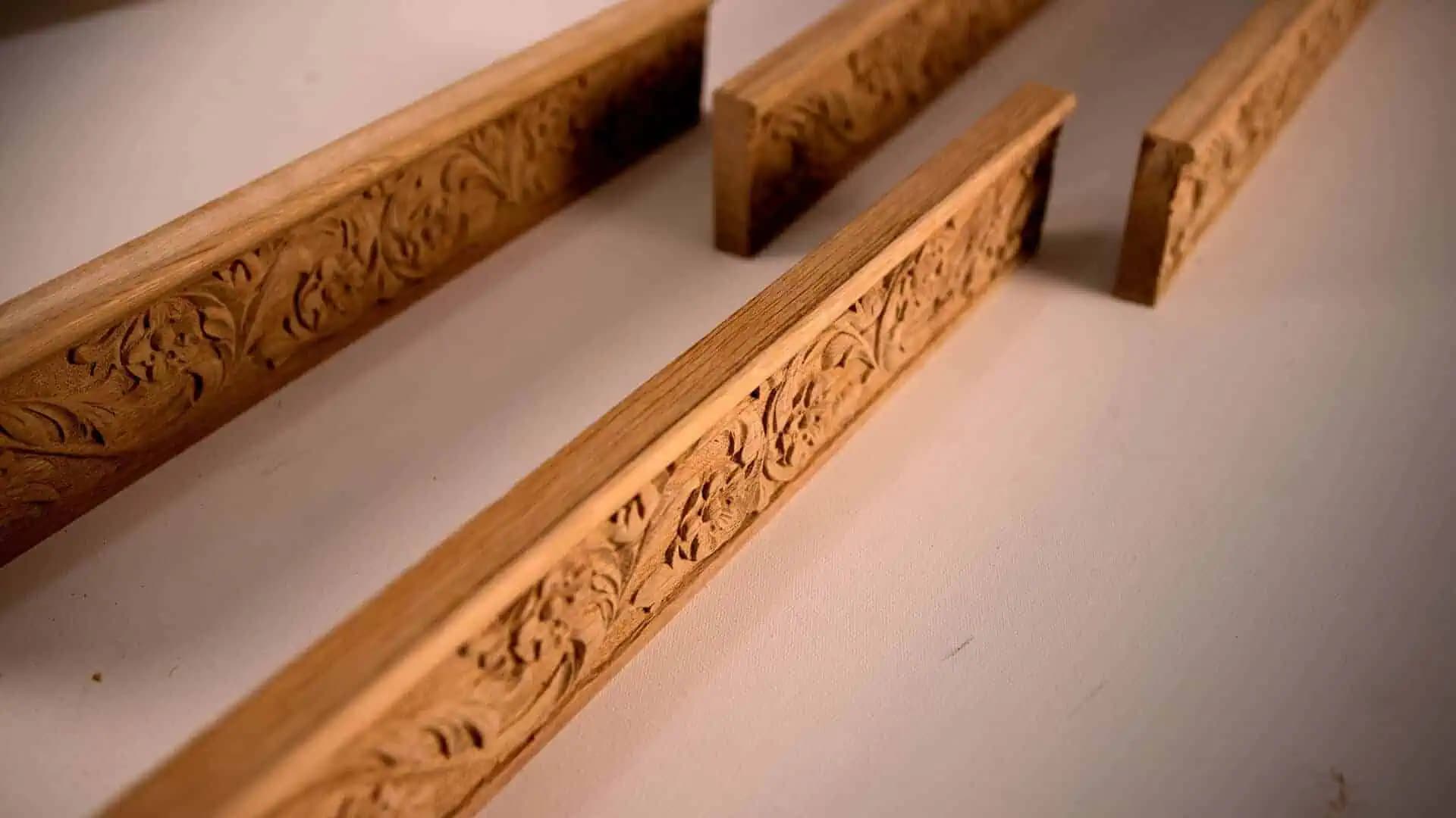 Oak molding strips with carved floral and leaf detail, custom wood carving by Alexander Grabovetskiy.