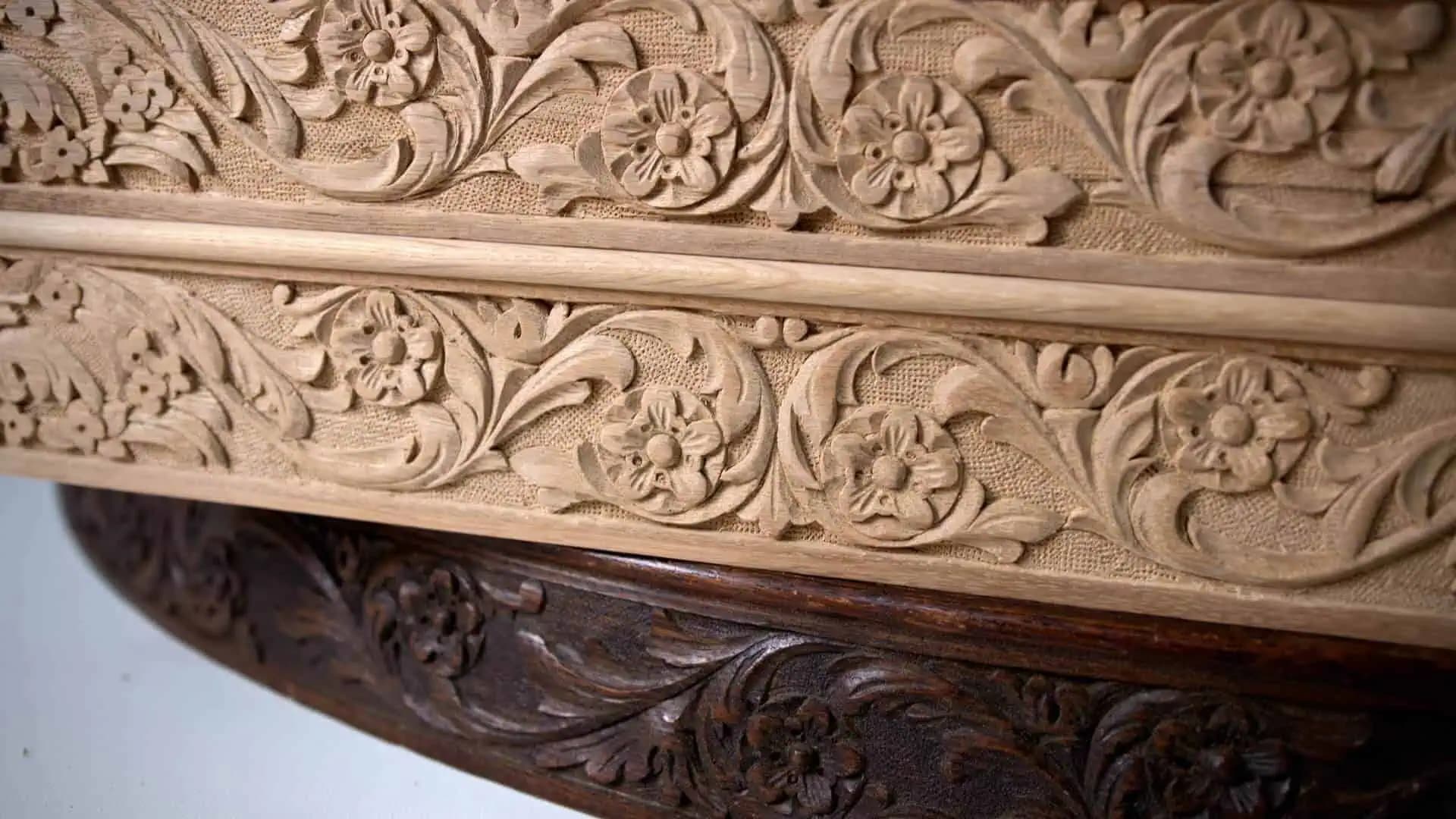 Floral scrollwork frieze freshly carved by Alexander Grabovetskiy as a custom wood carving in pale oak.