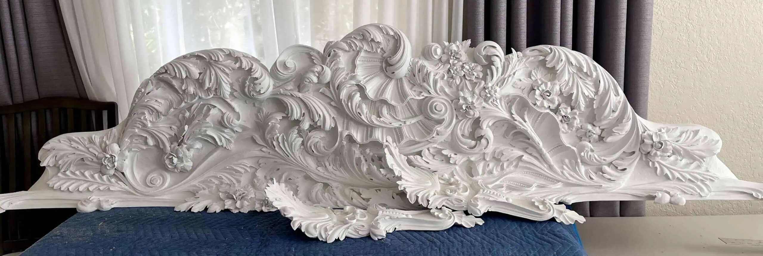 White-primed Baroque overdoor cartouche with scrolling acanthus and flowers, custom wood carving by Alexander Grabovetskiy.