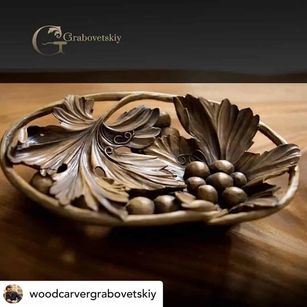 Limewood bowl with carved grapes and vine leaves, a custom wood carving by Alexander Grabovetskiy.