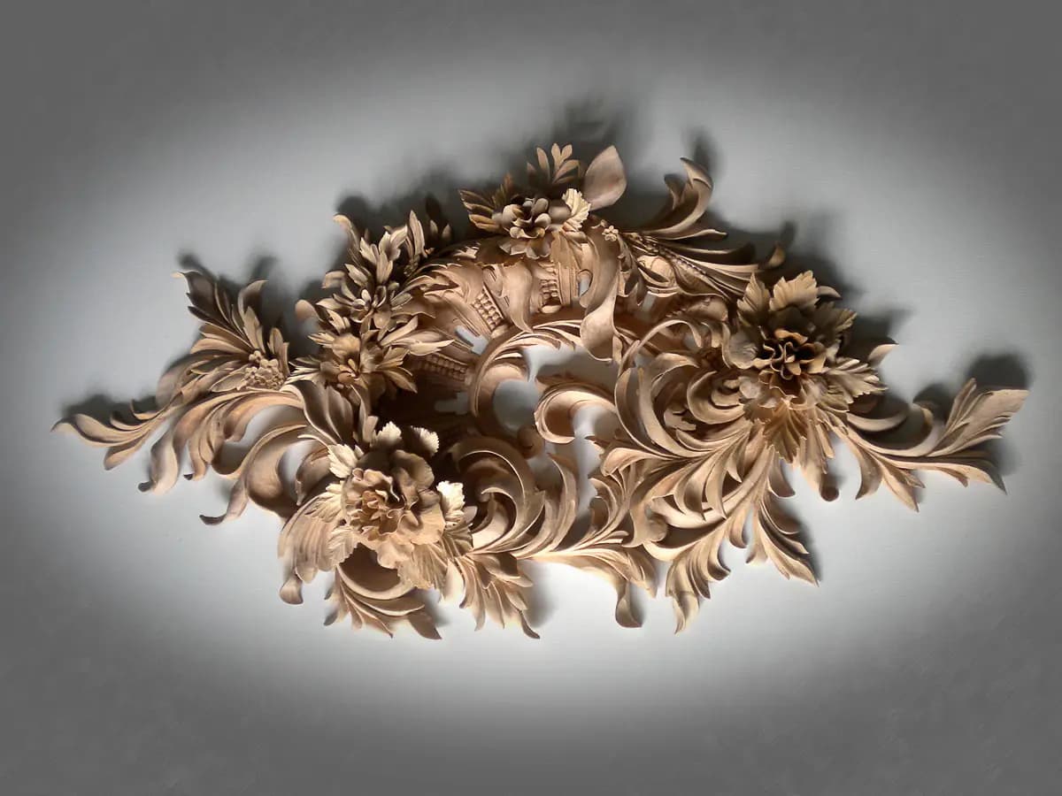 Limewood floral and acanthus cartouche, a custom wood carving by Alexander Grabovetskiy with high-relief blossoms and scrolls.
