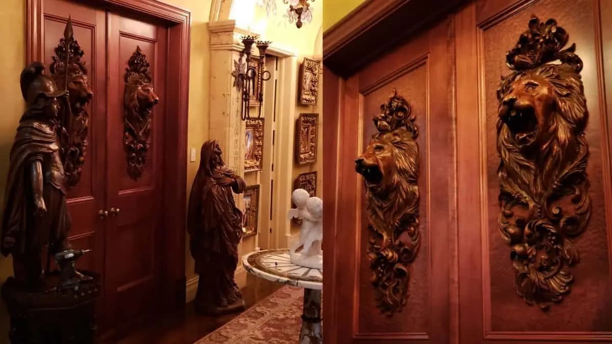 Limewood lion heads with acanthus scrollwork on wood doors, custom wood carving by Alexander Grabovetskiy.
