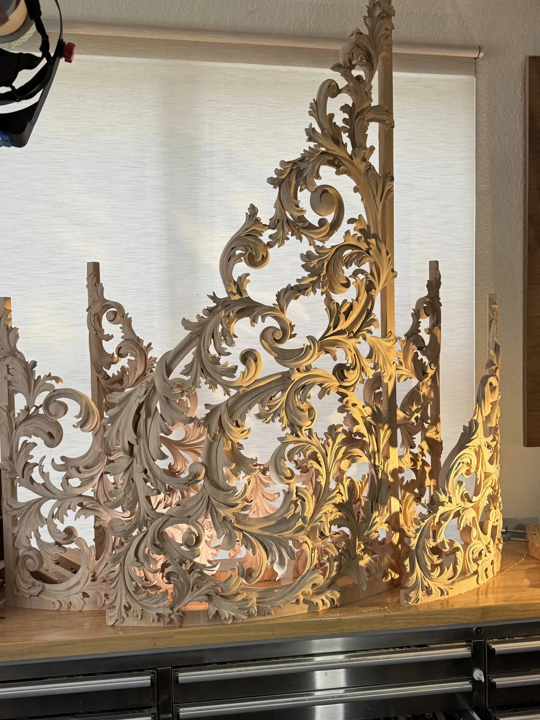 Curved acanthus pipe organ shades, a custom wood carving by Alexander Grabovetskiy in limewood.