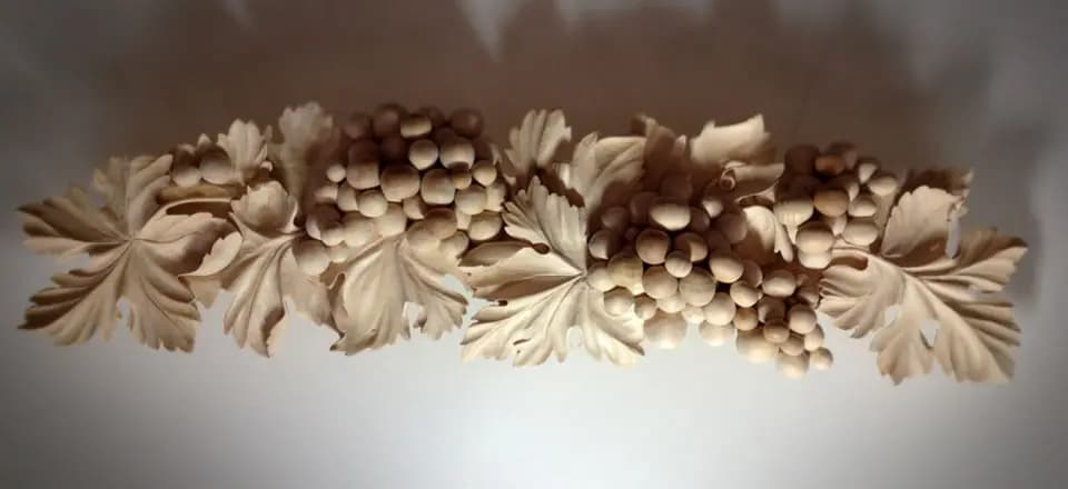 Limewood frieze of grape clusters and vine leaves, custom wood carving by Alexander Grabovetskiy.